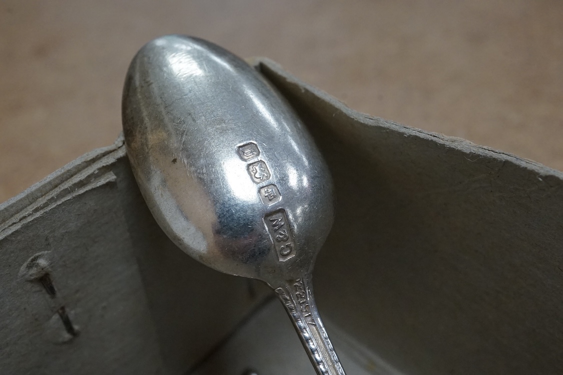 A group of assorted silver and white metal tea and coffee spoons and a pair of silver sugar tongs, weighable hallmarked silver 8.6oz.